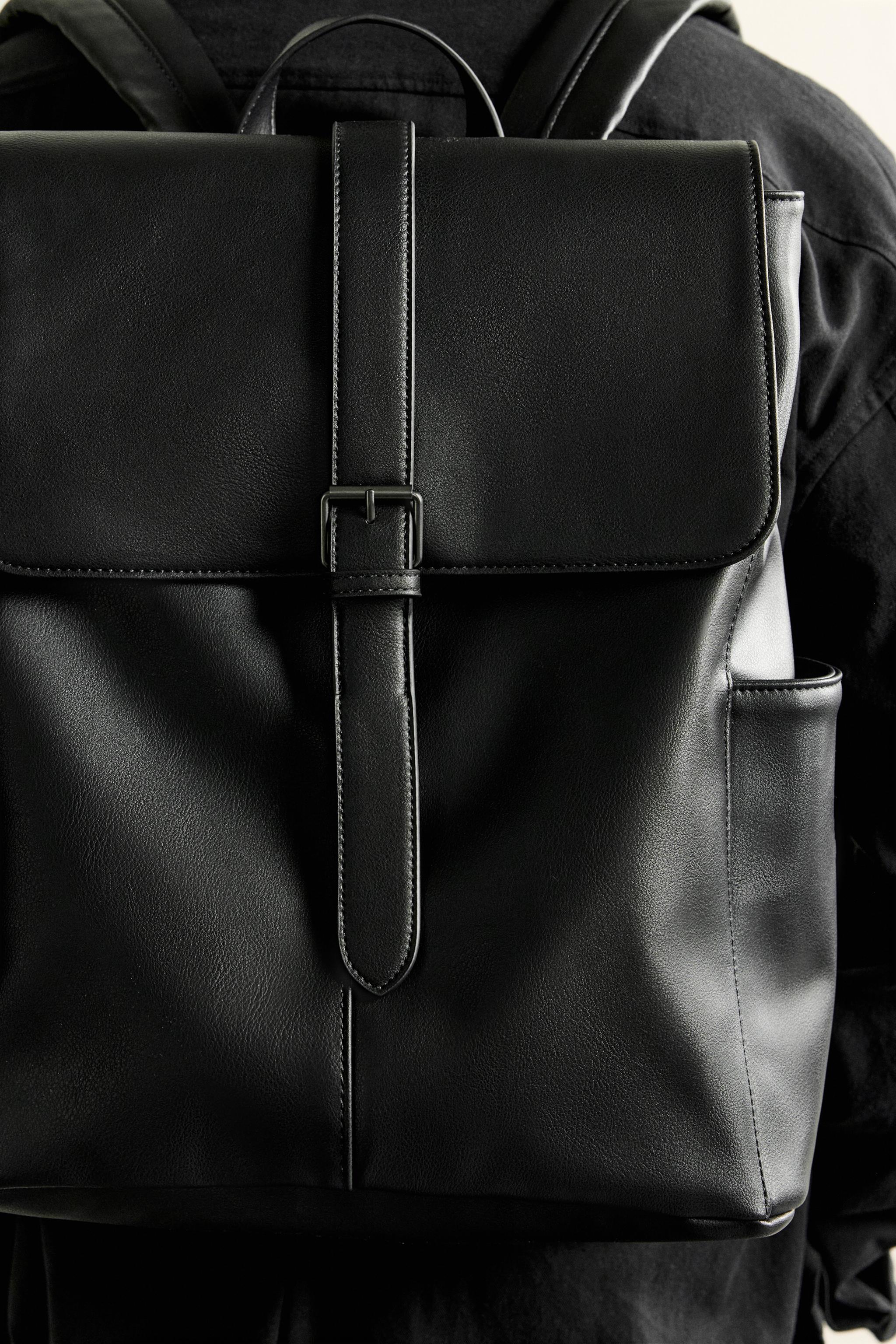 BELTED FLAP BACKPACK